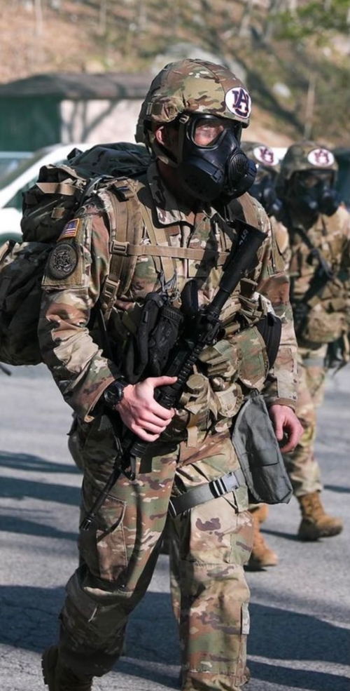 Reagan in Army uniform with gas mask and AU on helmet