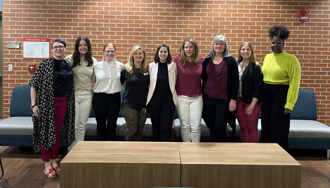 Welcome to the 2023 EmpowHER Conference. Left to right: Kim Holman, Bennett Schrimpf, Katie Marlow, Teddy Dubose, Cara Britain, Kristen Jackson, Mary Lou Ewald, Jess Gilpin and Kimberly Mulligan-Guy.