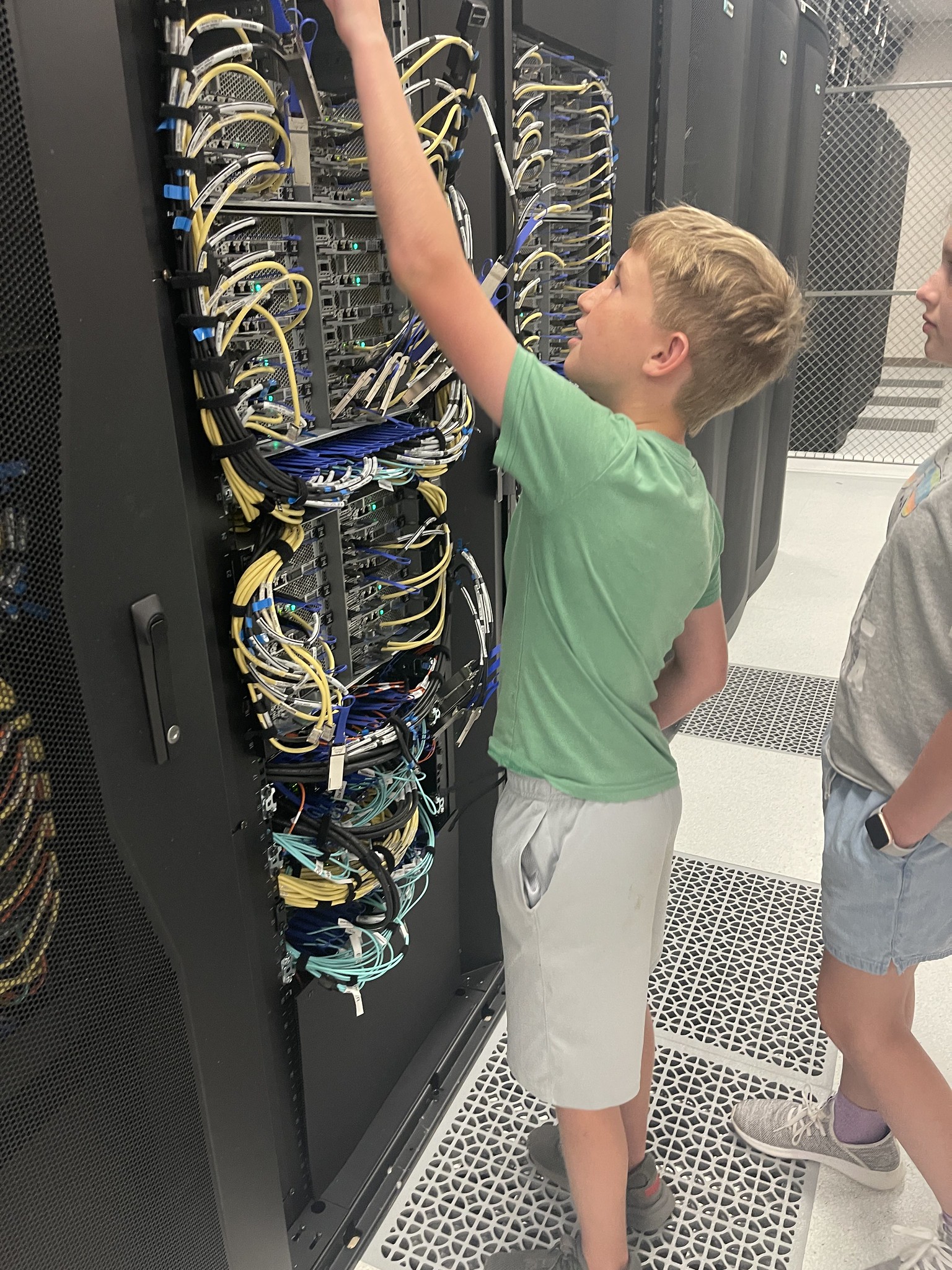 A camper visits the Easley supercomputer during the math week of camp.