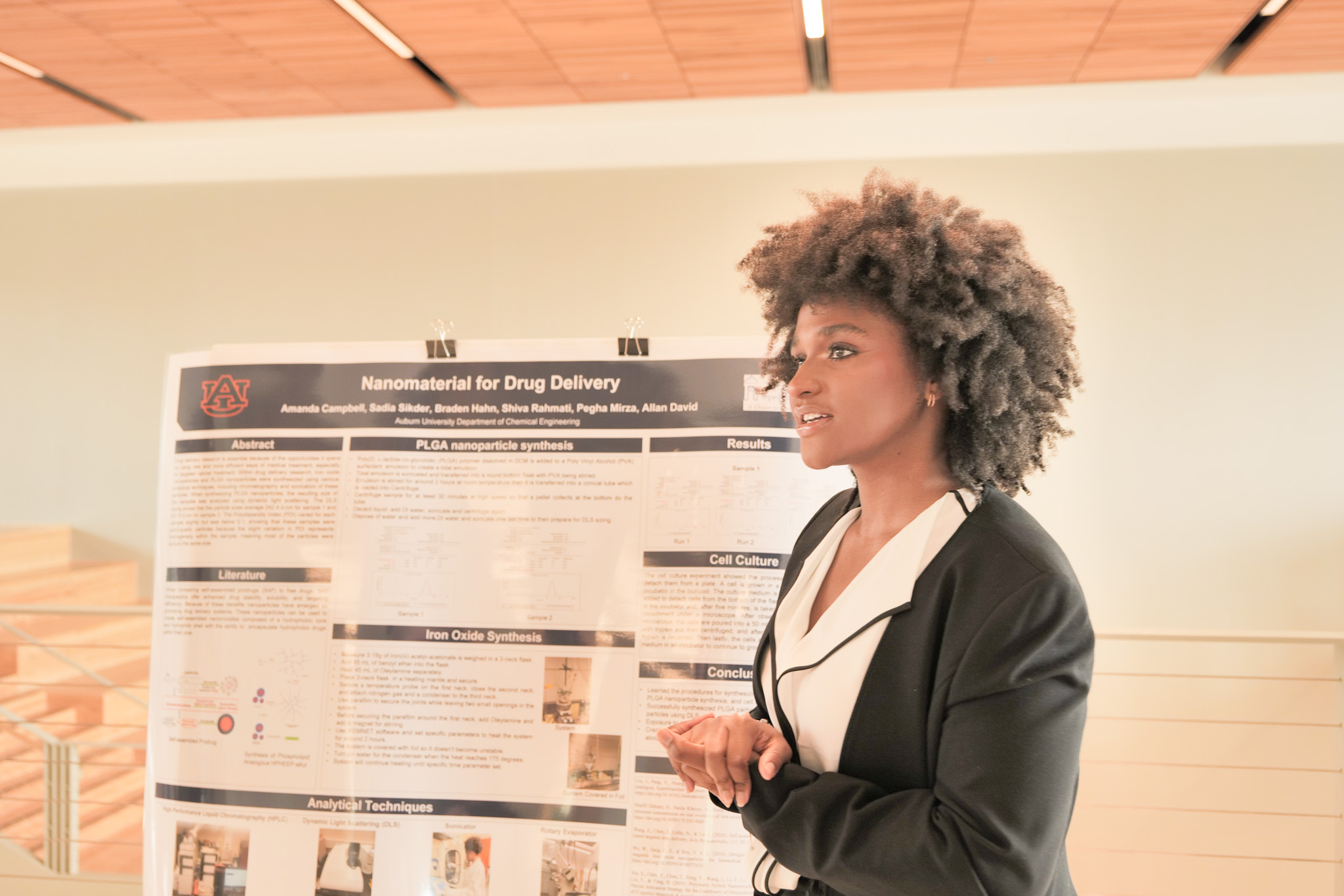 Amanda Campbell from Spelman College explains her research poster at the closing ceremony. 