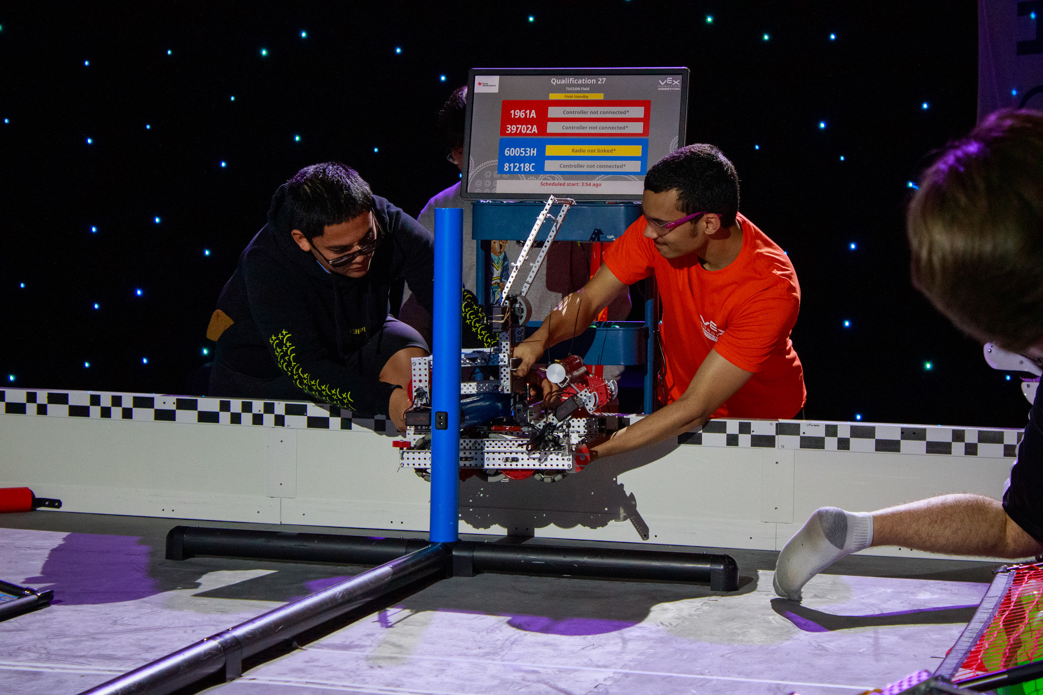 A robot climbs the field at VEX State to earn extra points.
