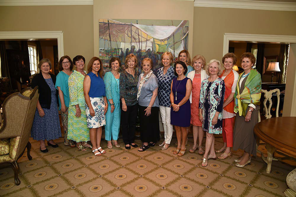 Members of the Auburn University Campus Club pose for a photo after the annual Spring Tea.