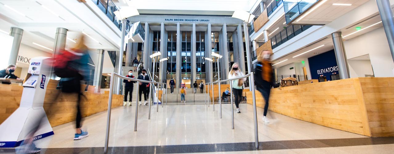 Students walk through the Mell Classroom building