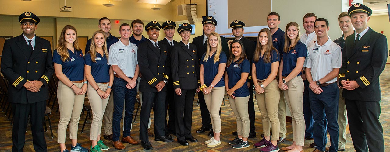 A student examines a vial of water.