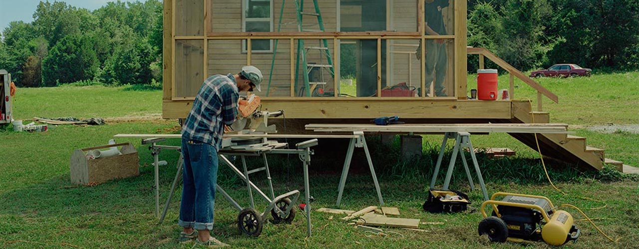 A student examines a vial of water.