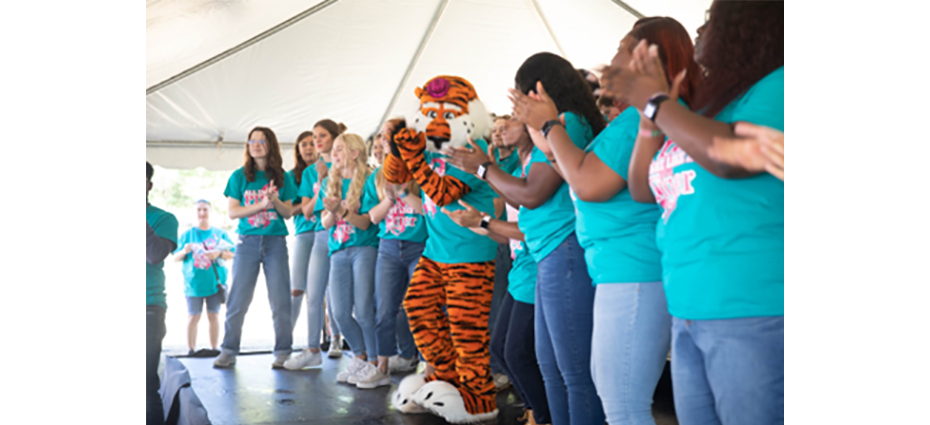 AU Choir singing at the 10th Annual All In All Pink Breast Cancer Event with Aubie.