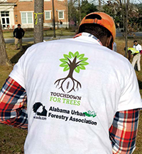 School of Forestry and Wildlife Sciences student and urban forestry class member Orum Snow shows off his Touchdown for Trees T-shirt.