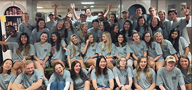Group photo of campus kitchens students wearing grey tshirts