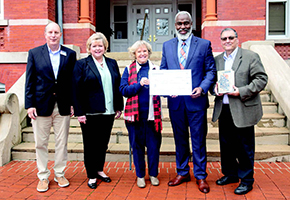 Members of University Outreach receive a check for $25,000 presented by Auburn Heritage Foundation. Pictured from left: Jim Franklin, OPCE assistant director for Auburn Youth Programs; Hope Stockton, assistant vice president for University Outreach and Professional and Continuing Education; Mary Norman, president, Auburn Heritage Foundation; Dr. Royrickers Cook, vice president for University Outreach and associate provost; and Sam Hendrix, author, “Auburn: A History in Street Names.”