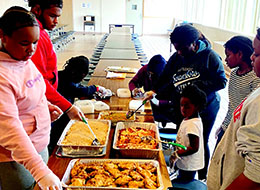 YPiT students packaging food for a shelter.