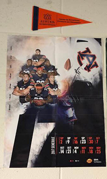 Auburn University penant and AU 2017 football schedule hang on the wall in a 3rd grade classroom.