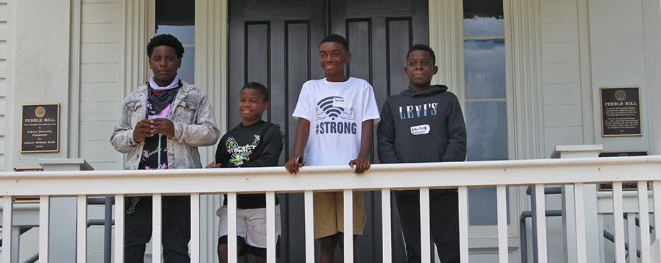 Picture of Young Scholars on the balcony of Pebble Hill.