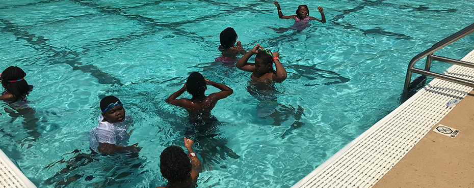 Boys and girls enjoy swimming in pool