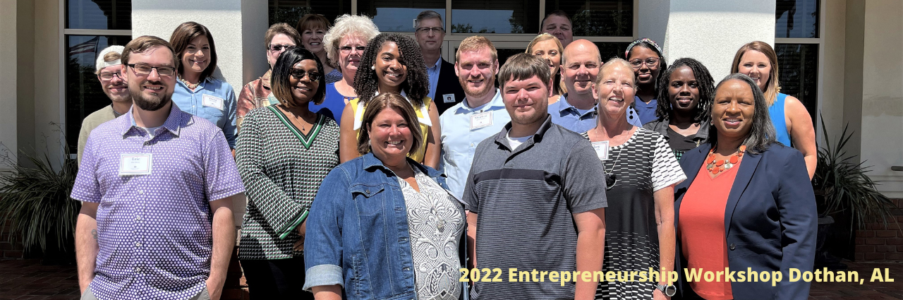 Image of group of class participants standing in front of building and text '2022 Entrepreneurship Workshop, Dothan AL'