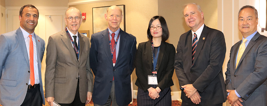 Group photo of conference organizers: left to right: Alex Helm, Dr. Jim Barth, Gene Steuerle, Xuan Shen, and Ken Chan.