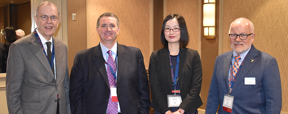 Dr. Jim Barth, George Buchanan, Xuan Shen, and Lou Bifano pose for photo at forum.