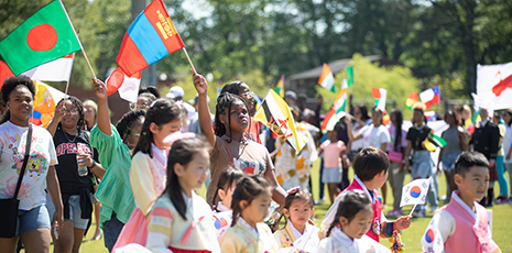 Children walk in the Parade of the Flags at Outreach Global's second annual Global Community Day Festival.