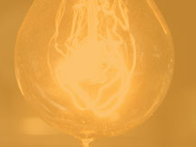 Yellow overlay - close up of lightbulb filament