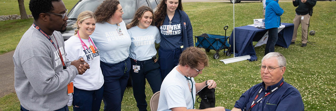 AU College of Nursing students and their instructor Chris Martin examined a participant at the main Festival event at the Opelika Amphitheater