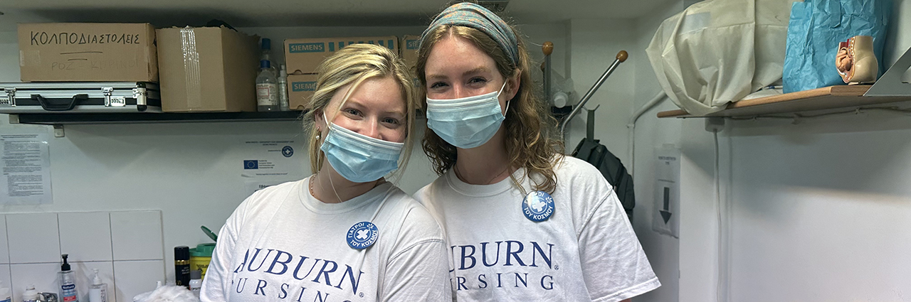 Two AU Nursing students pose at the Doctors of the World polyclinic.