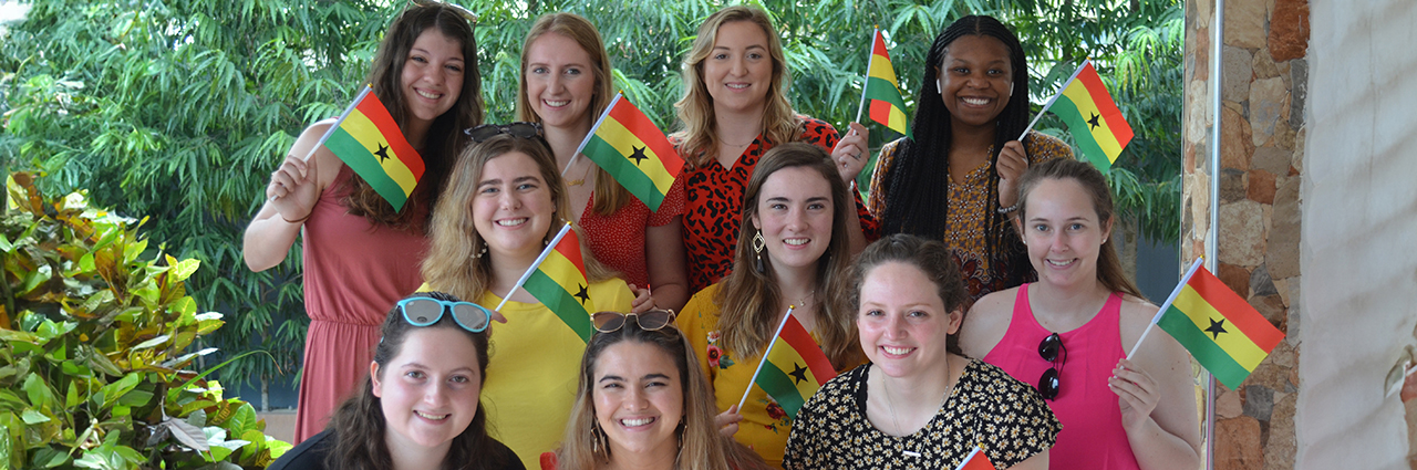 Students holding Ghanaian flags
