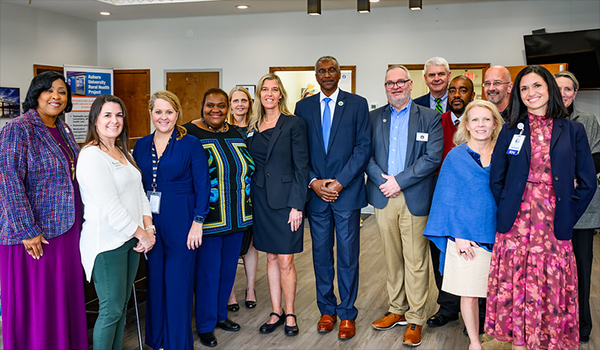 Nivory Gordon, state director of USDA Rural Development (center), is surrounded by faculty and community partners working with Auburn University’s Rural Health Initiative.