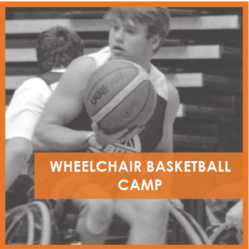 Boy in wheelchair holding basketball
