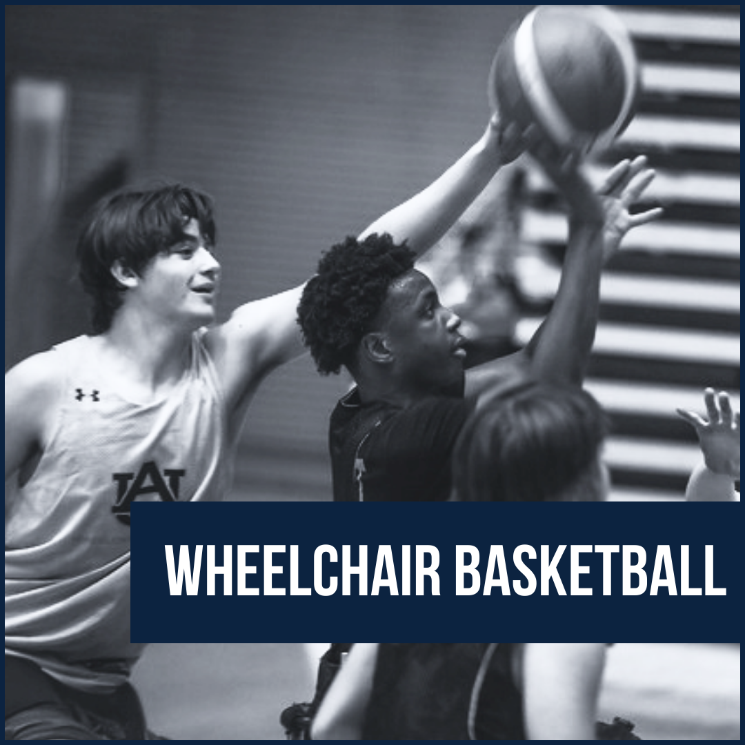 Boy in wheelchair holding basketball with two boys looking at him throw the ball