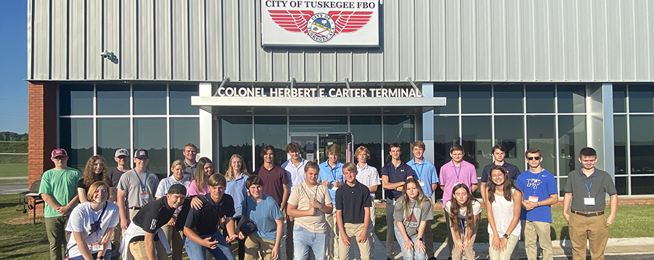 Aviation campers pose in front of Tsukegee's Colonel Harbet Carter Terminal.