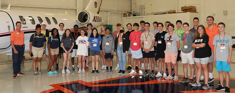 All of the Aviation students pose with Dr. James Birdsong in the Auburn University airplane hangar.