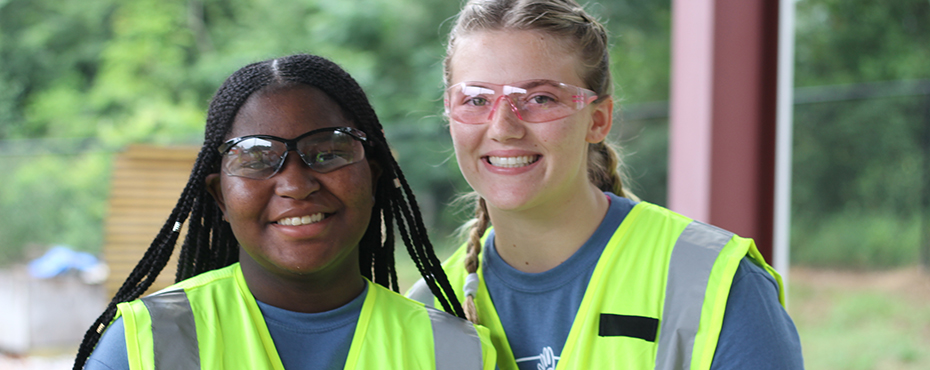 Two students in construction vests 