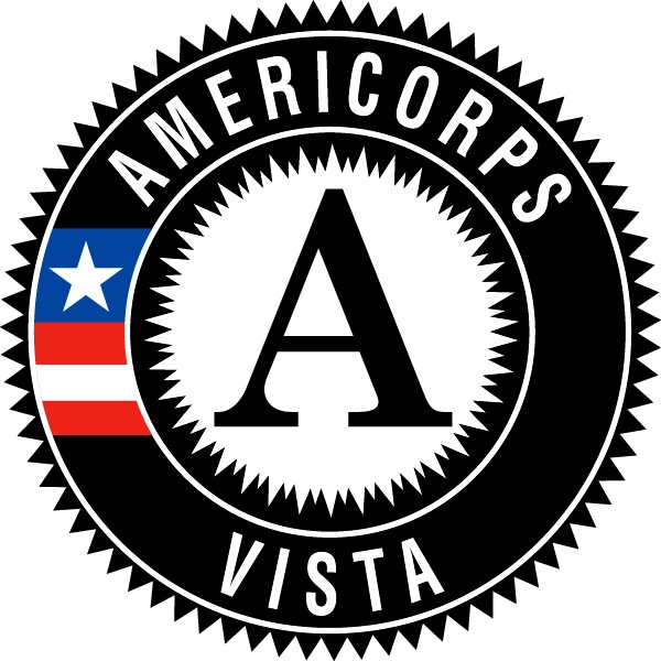 AmeriCorps Vista around edge of black badge with partial flag and white center with capital letter A
