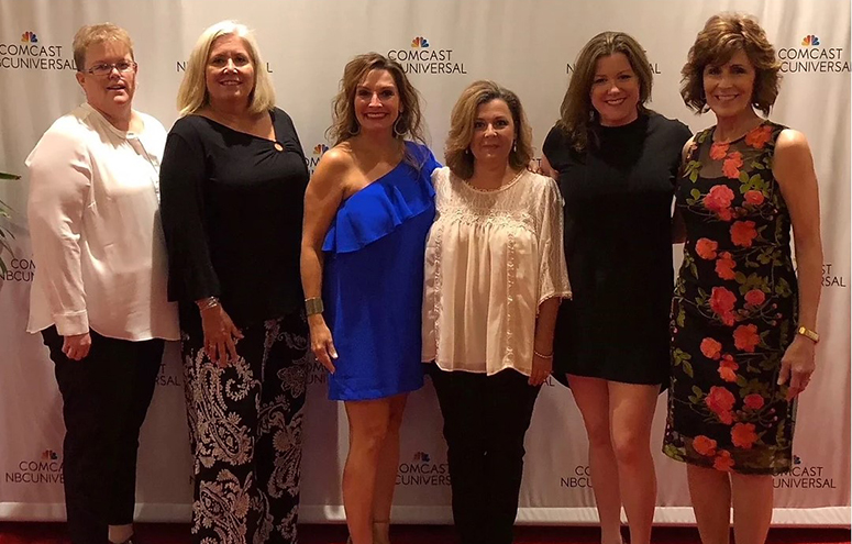 A group of women from Big Brother Big Sisters taking a photo at a Gala.