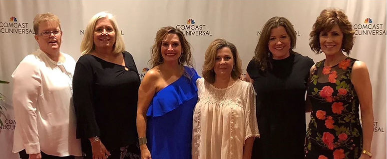 A group of women from Big Brother Big Sisters taking a photo at a Gala.