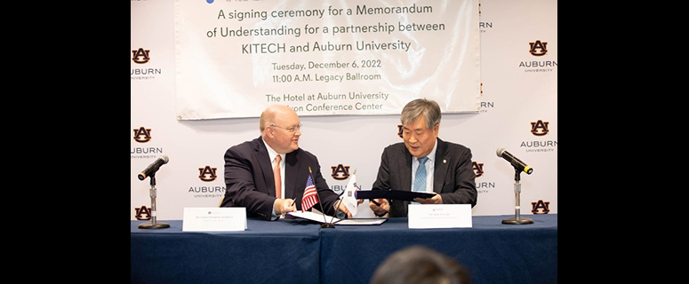 President Roberts of Auburn University pictured with a member of Kitech for the signing of the MOU between Kitech and Auburn University.