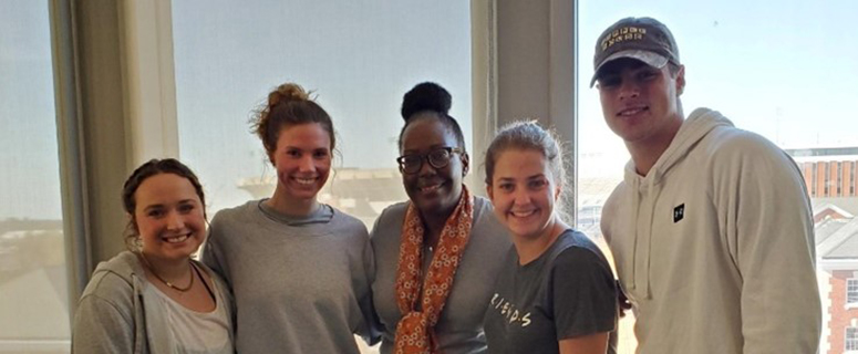 Executive Director, Patricia Butts, attending a Philanthropy and Nonprofit Studies class and pictured with a group of students.