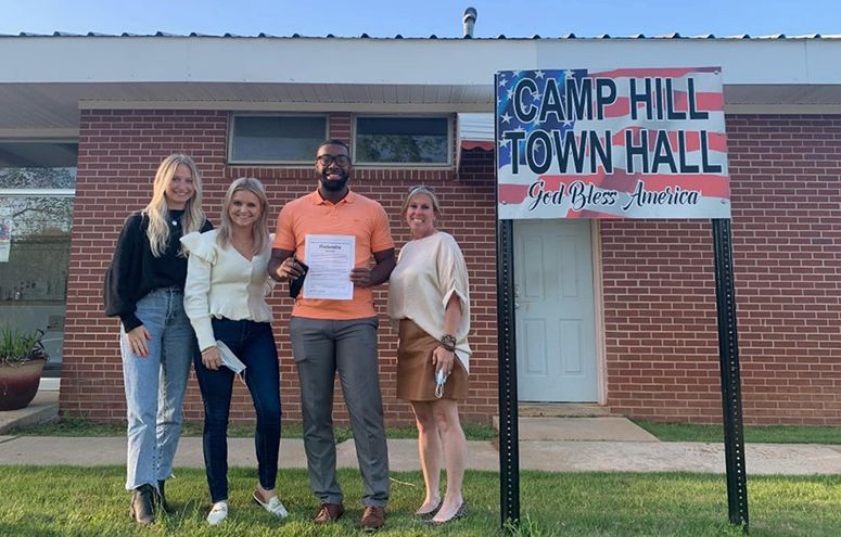 Members of Rape Counselors of East Alabama pictured with Camp Hill’s Mayor, Messiah Williams-Cole.