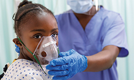 Young girl gets breathing treatment in hospital